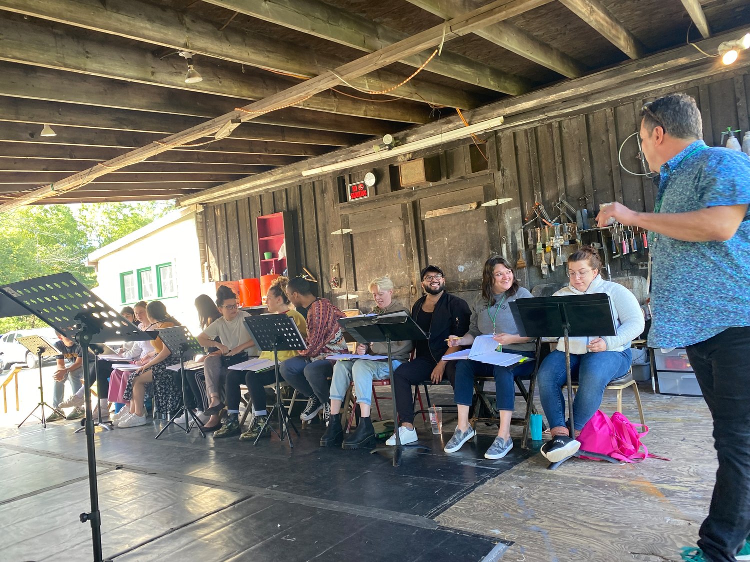 Artistic Director Matt Lenz with the cast of "By Any Other Name" in rehearsal on the back deck at the Forestburgh Playhouse.